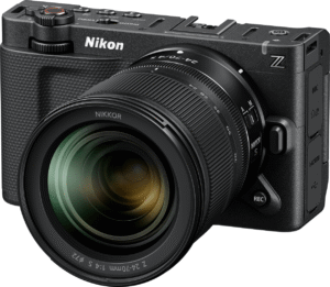 Nikon ZR mirrorless camera with a retro design placed on a wooden table
